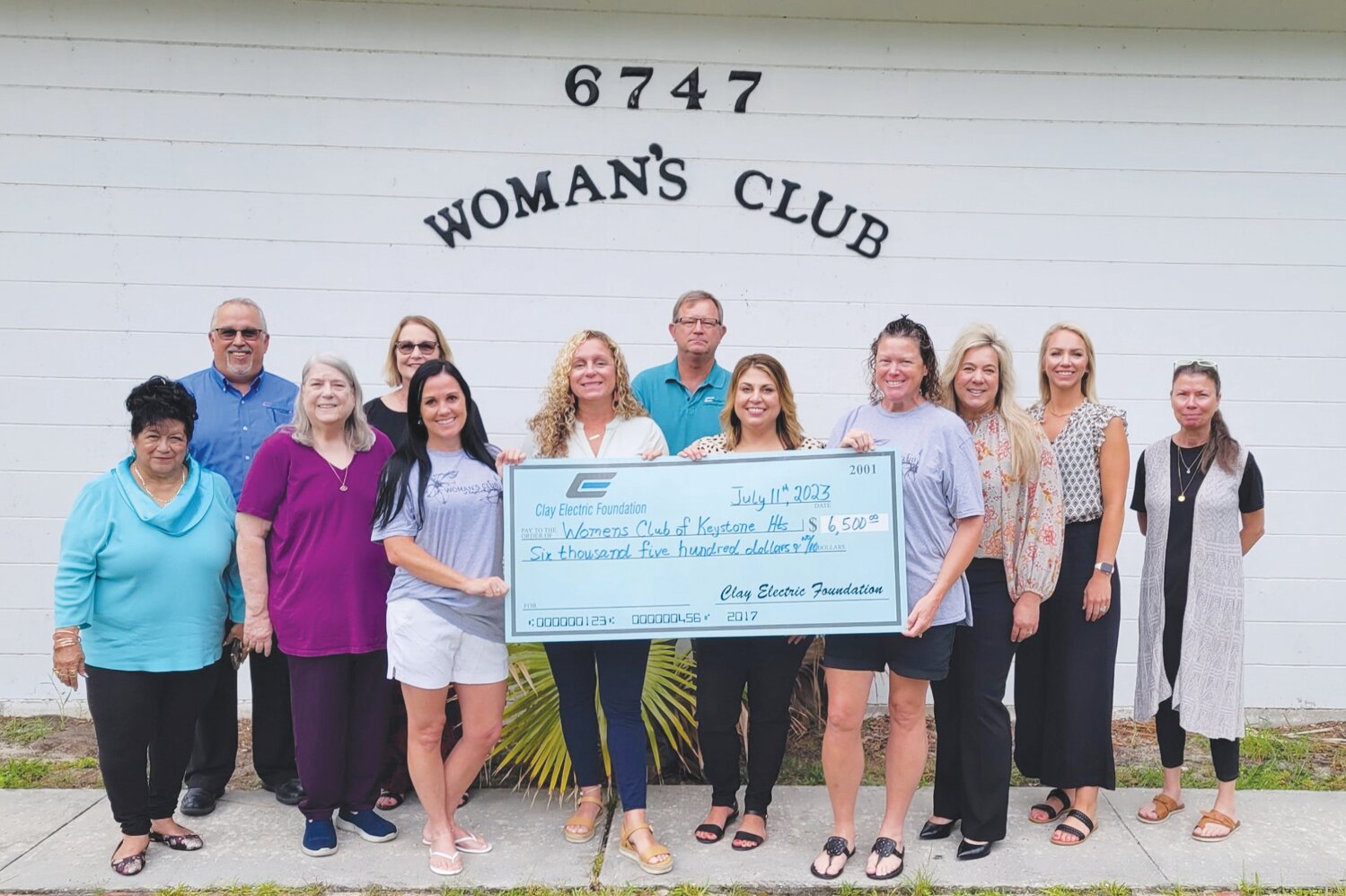 From left, Junior Woman’s Club members Maria Walker, Tina Bullock, Tori Hersey, Amy Webber, Brooklyn Hayes-Yelin, Dana Eatmon, Cindy Loose, Kim Dyal and Karan Lake were thrilled to get the donation from Clay Electric.