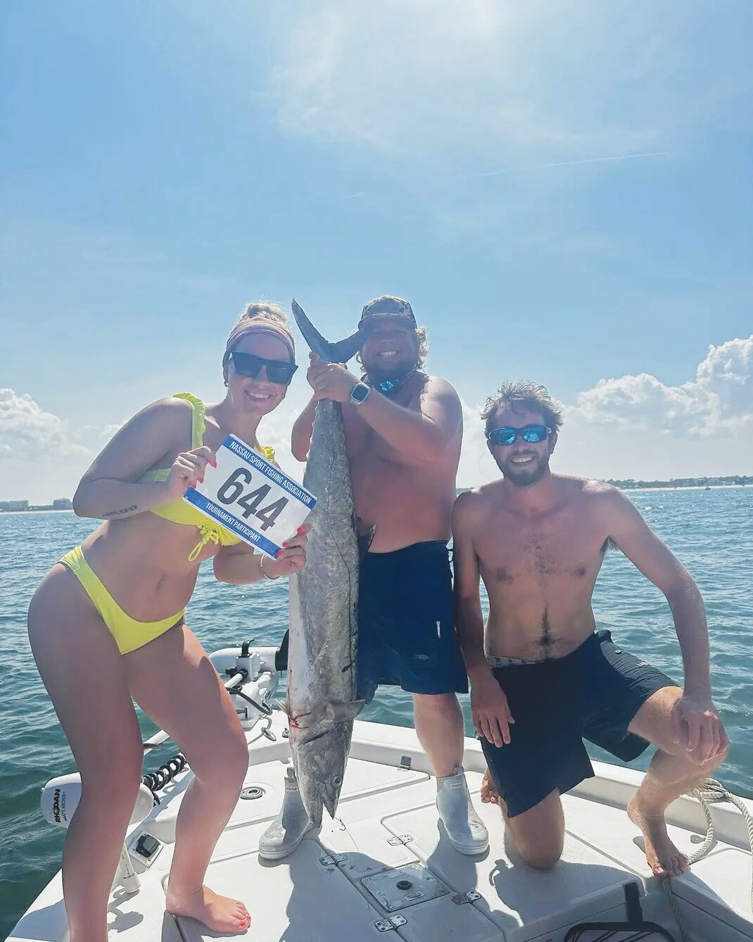 Laura Baylor shows off her first-place Lady Angler 34 lb kingfish caught at the Nassau sport fishing association 40th annual Kingfish tournament. Baylor, here with Robert Vogt, former St John’s Country Day Superstar football player, caught the fish on a downrigger using a ribbon fish.
