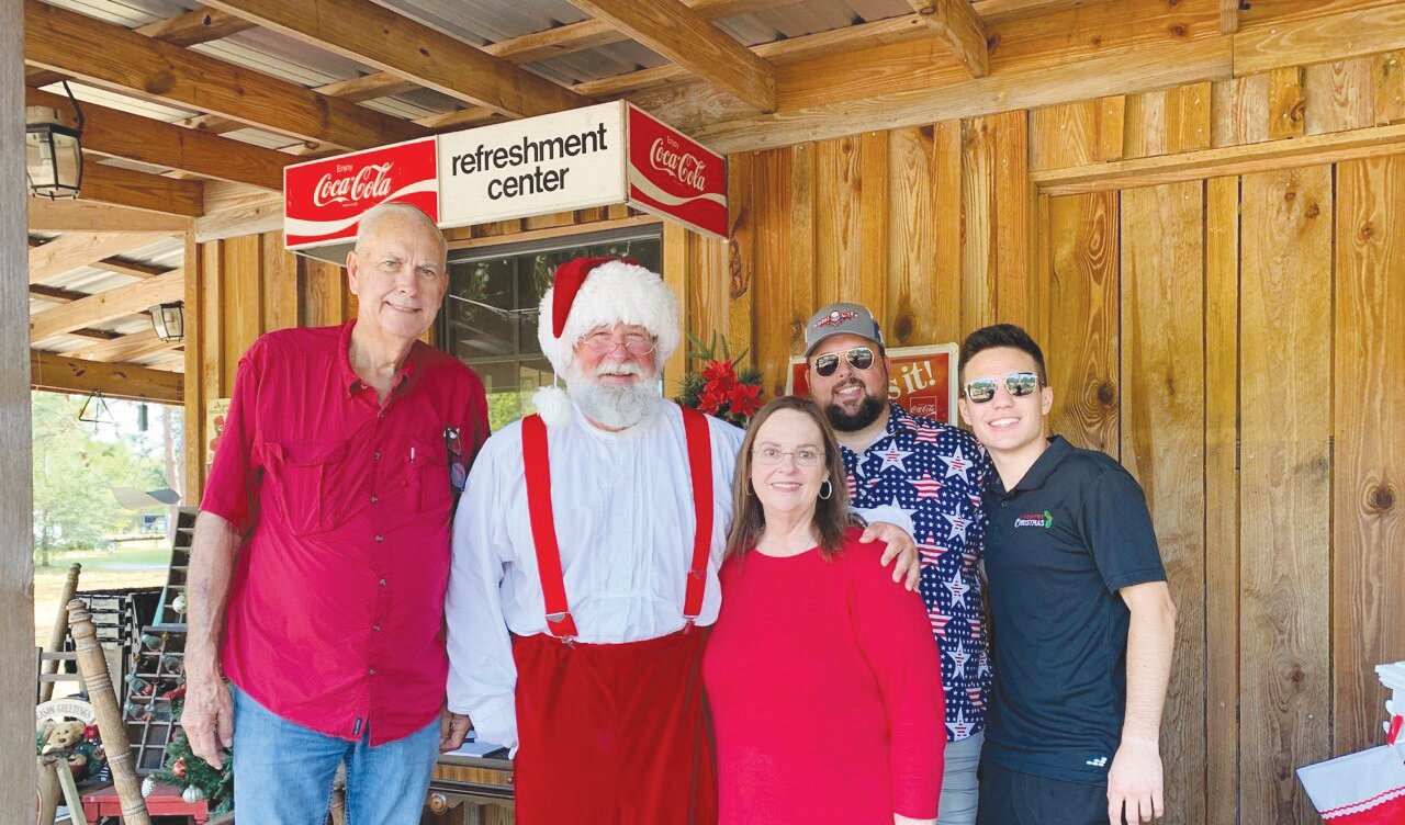 Founder Matthew Mitchell, right, the Elrod family and volunteers began preparing the property for “A Country Christmas” on Saturday, which will feature more than one million lights.
