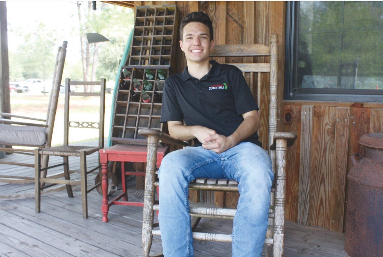 Founder Matthew Mitchell takes a break after getting the property at Elrod Farms prepared three months in advance for “A Country Christmas.”