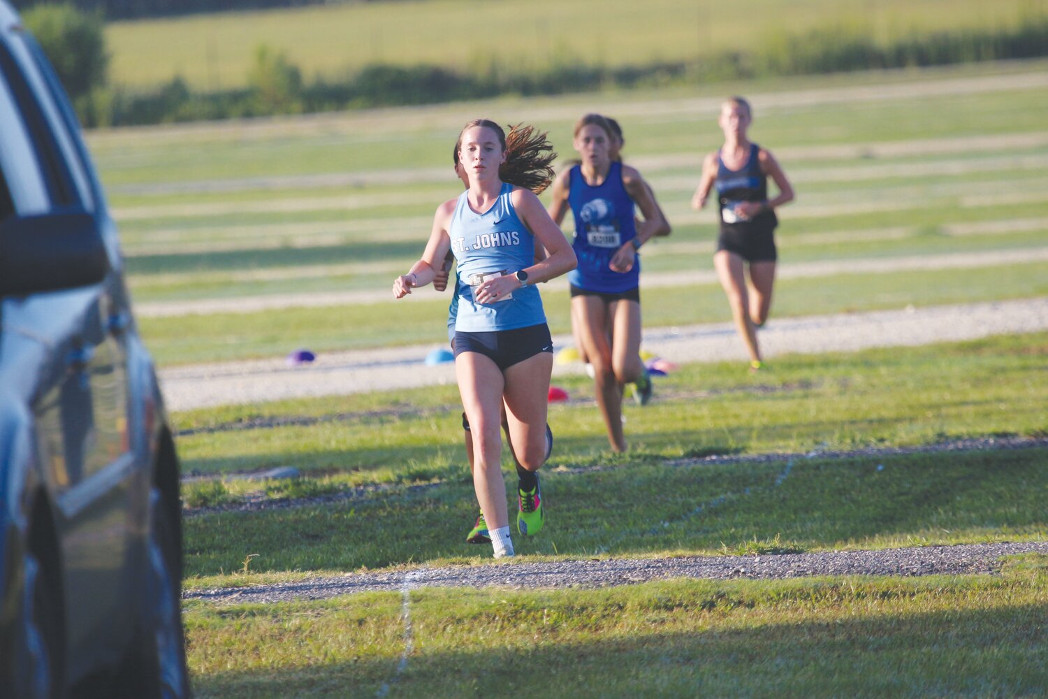 St. Johns Country Day School junior Rebecca Stratton, here in front at the Clay County Cross Country Invitational, rode that momentum of her first win to a second-place finish a week later at the Embry-Riddle Invitational in Daytona Beach.