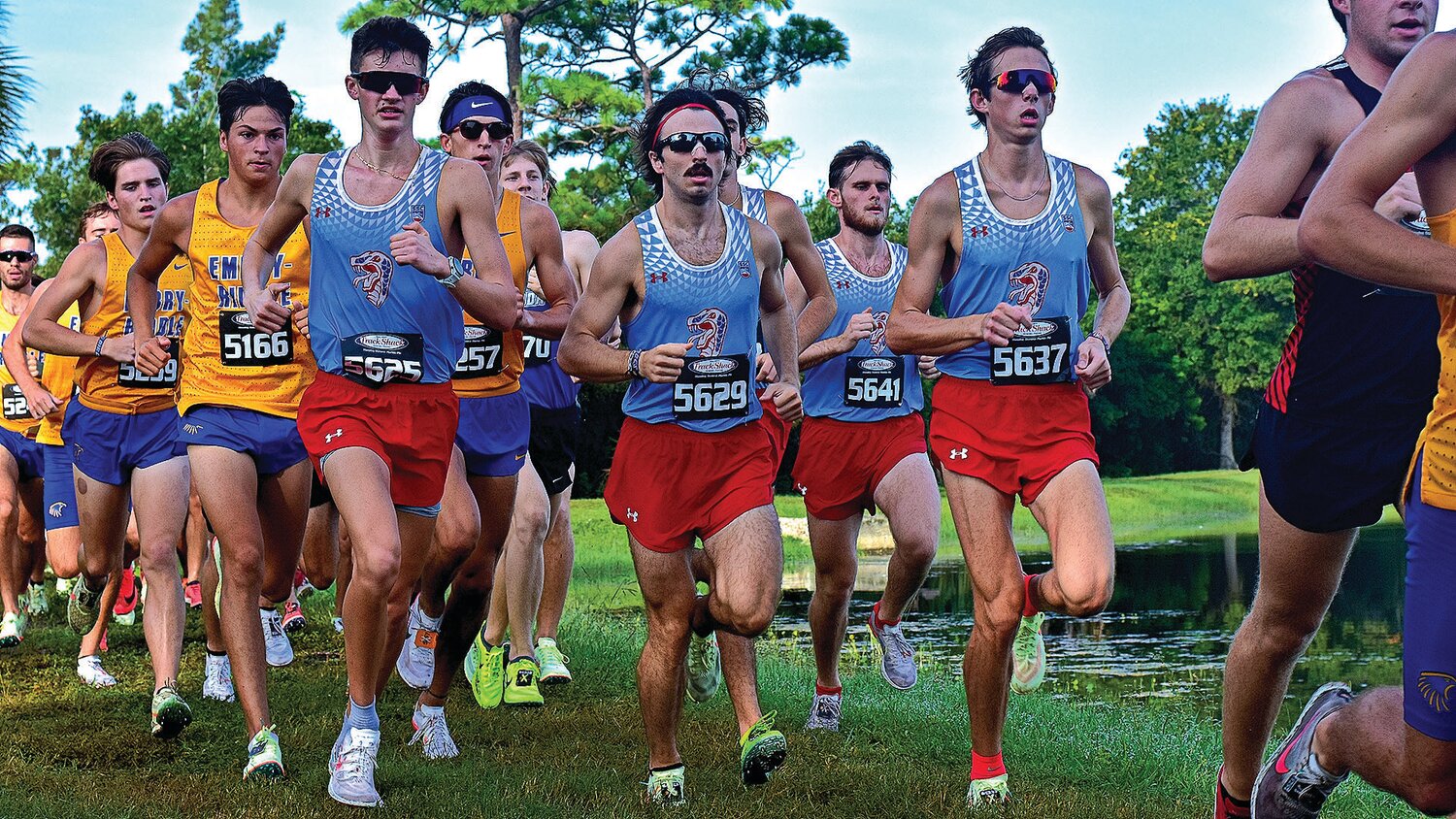 Former Keystone Heights High cross country runner Alex Guy, in center with sunglasses, chased Ridgeview’s Joel Nesi at Mountain Dew Classic in Gainesville.
