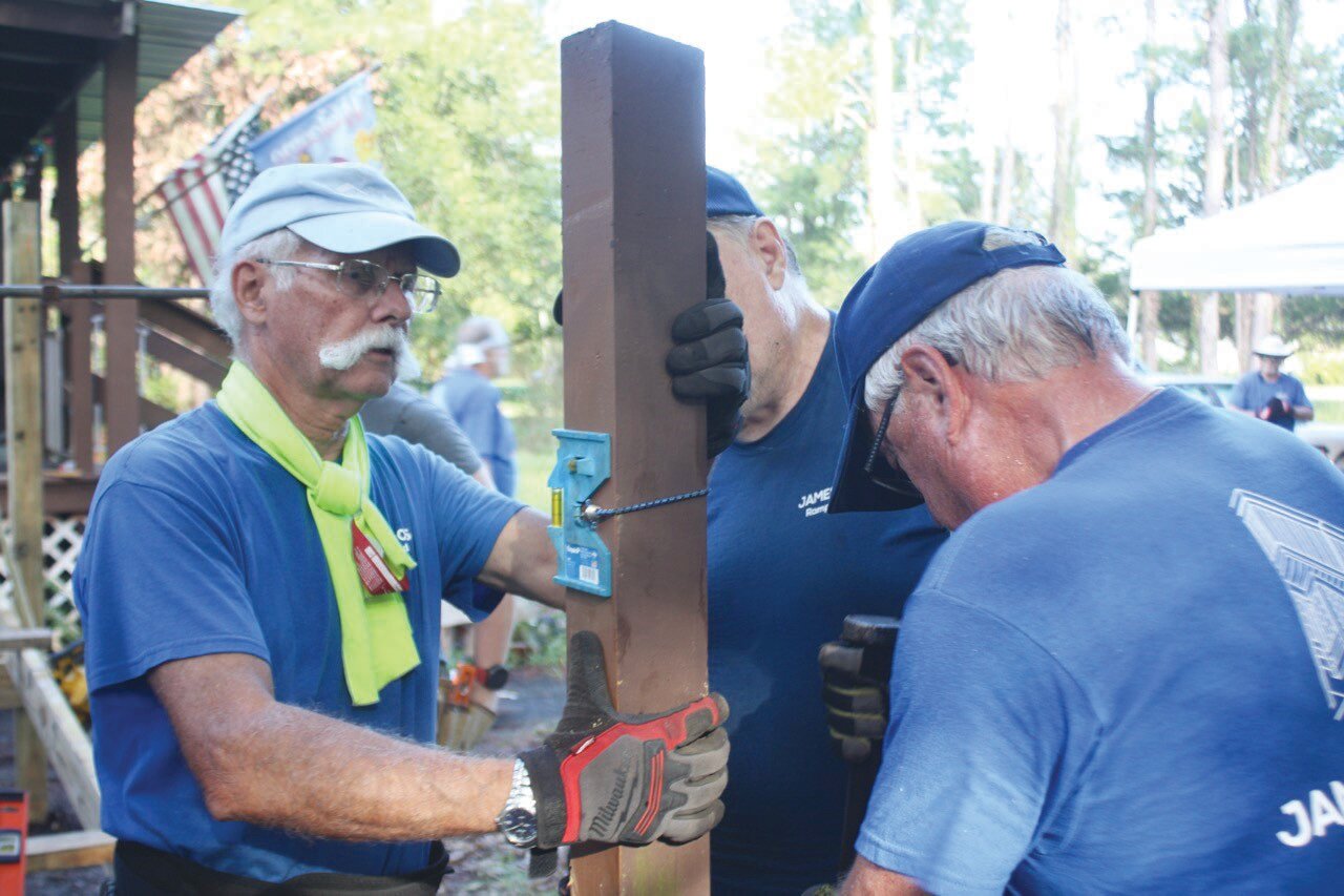 The James Boys is a volunteer group working with Clay County Habitat for Humanity that builds wheelchair ramps for needy residents. On Monday, they reconstructed a ramp for Linda Harris, a resident of Clay Hill.
