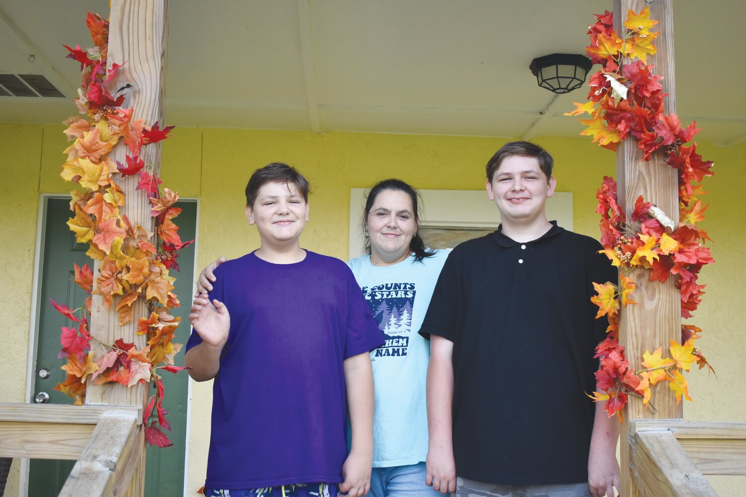 From left, Joshua, Crystal and Matthew Chisholm now have a home in Green Cove Springs. True Vine Fellowship, Penney Retirement Center, Breaking Bread Ministry and Orange Park United Methodist Church James Boys all banded to help the family who lost their home and were forced to live in a shed or car. True Vine’s Pastor John Sanders gave the family keys to their home.